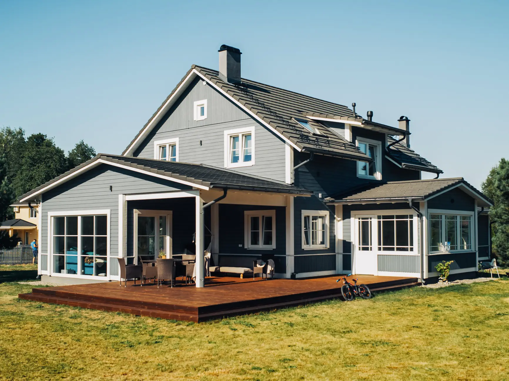 Two-story house with large windows