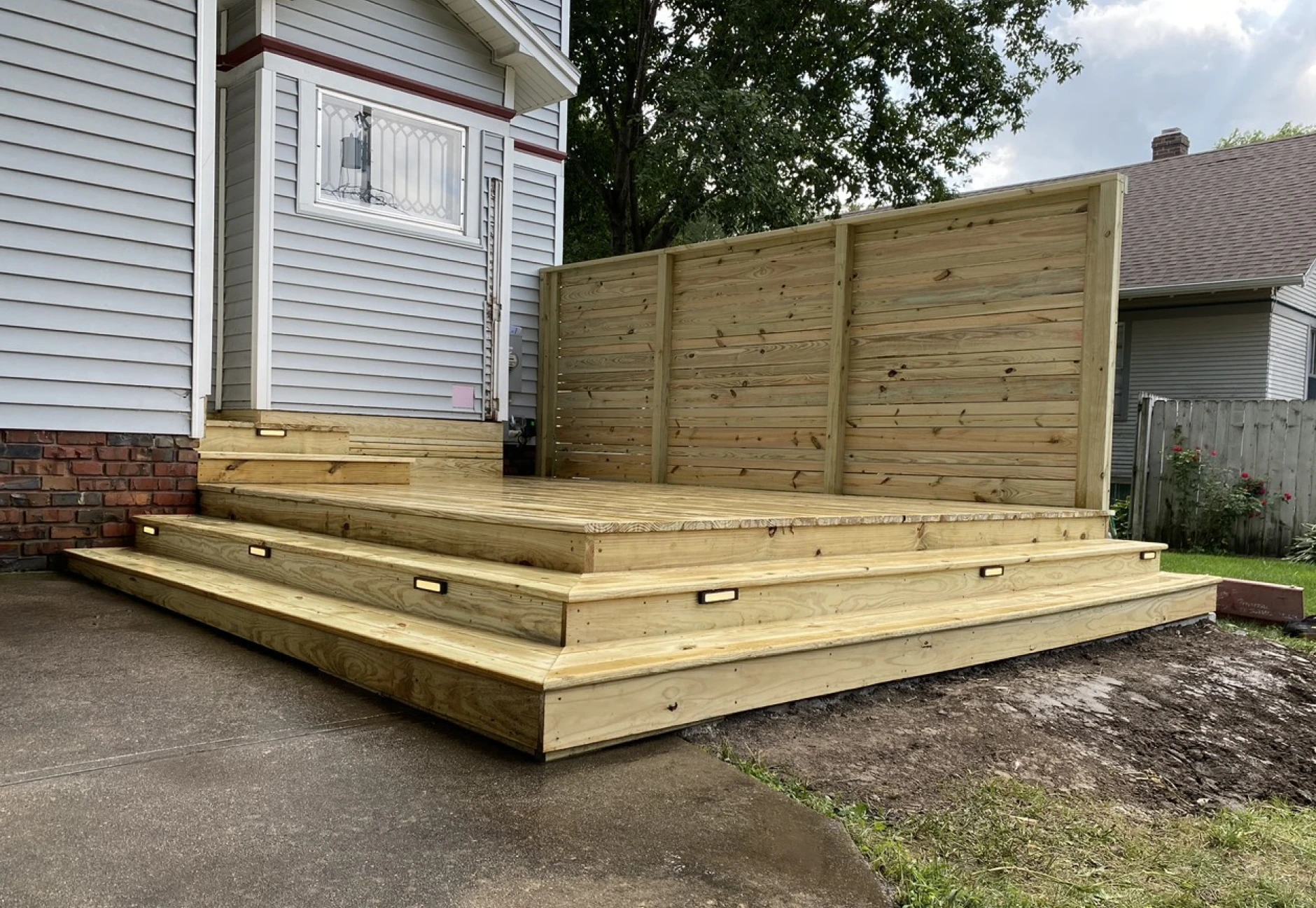 Wooden deck with privacy fence